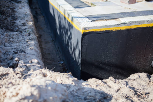 Professional Waterproofing technician working in Crystal, MN
